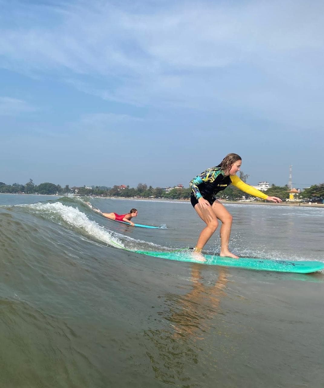 Surf lesson on a small wave in Sri Lanka
